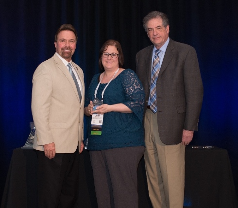 Image of Kelsey Olsen Accepting PACE Technovation Award for TextBetter